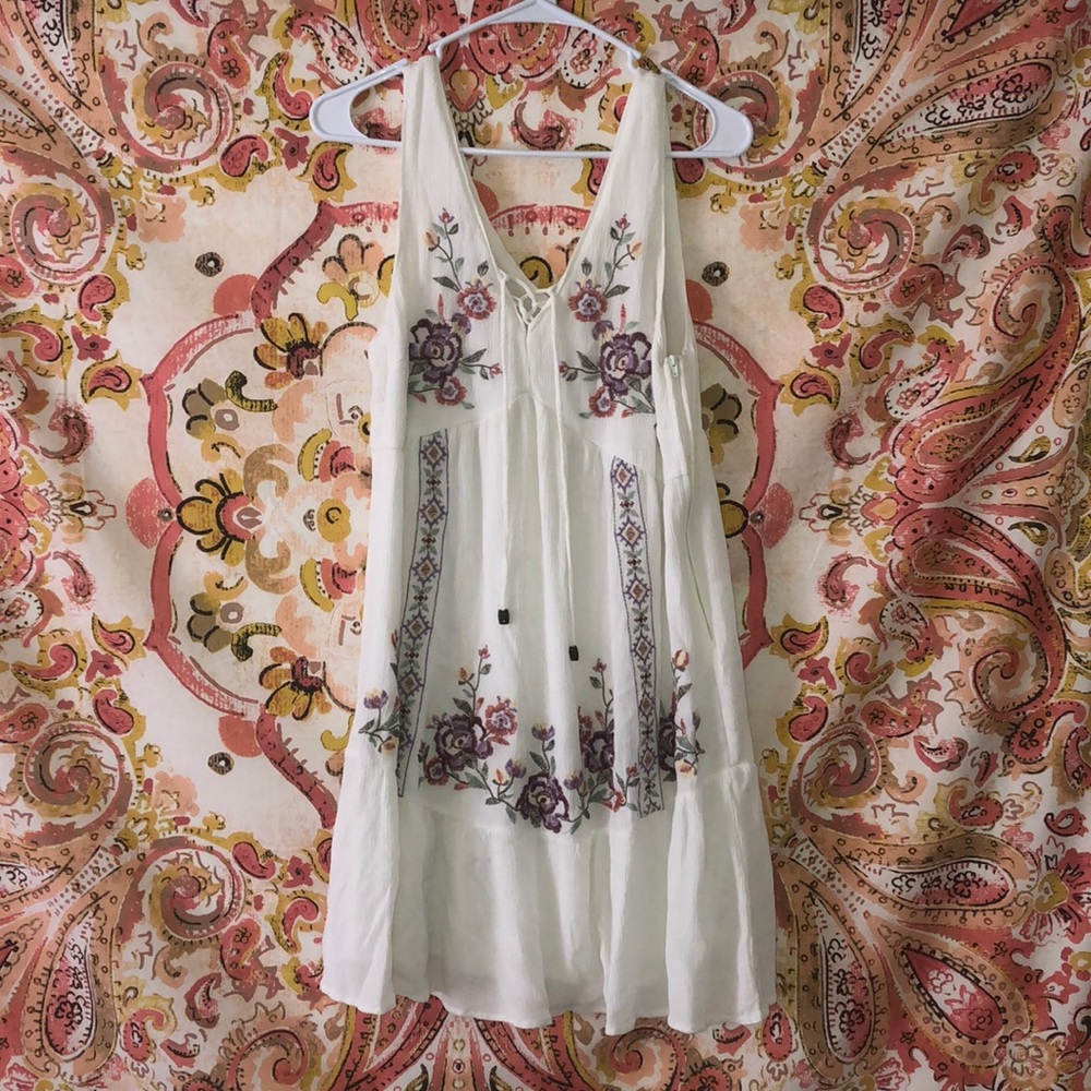 White dress with colorful embroidery